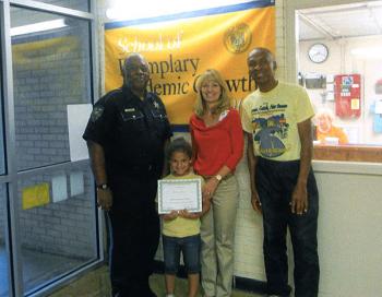 Bryanne Davis of M.E. Norman Elementary School was recently honored by school faculty as student of the month for September. From left, Earl Johnson, St. Mary Parish deputy/mentor; Davis; Shannon Hoffpauir, M.E. Norman Elementary School principal; and Herman Hartman, mentor.
