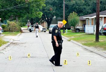 Morgan City police place evidence markers next to bullet casings this morning at Federal Avenue and Orange Street. A black male in a white Lexus was wounded at Lawrence Street and Levee Road. Multiple shots were reported at about 10 a.m. A lockdown at Maitland Elementary, Norman Elementary, Central Catholic High and Holy Cross Elementary schools were lifted by noon. Superintendent Donald Aguillard said he had been told the shooter was believed to be in the area, possibly in a nearby house.
