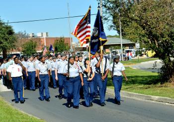 Junior ROTC members lead the Red Ribbon Parade of Schools Saturday on Victor II Boulevard in Morgan City.

