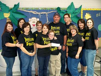Berwick Elementary recently held its annual fundraiser to benefit the Down Syndrome Association of Acadiana. The fundraiser was held in support of Peyton Anslem, a fifth-grader at the school. Front, from left, are Susie Adams, Jean Cantrell, Anslem and Ellen Lahoste. Back row, from left, are Kit Guidroz, Micah Kelly, Debbie Tompkins, parents Earl and Dawn Anslem, Liz Mitchell and Shelly Booth.  