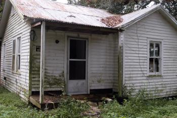The house at 6 Darce Lane has sat vacant since the night in February 2010 when its residents Audrey Picard, 75, and Larry Guillory, 49, were brutally murdered. The trial of suspect Jamichael Lashawn Hudson, 18, is ongoing in 16th Judicial District Court. 