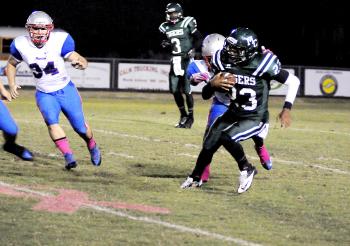 Morgan City’s Jaylen Jones makes a return during the Tigers’ contest with Ellender Friday. Jones, back after sitting out a few weeks due to an injury, tossed two touchdowns in the double overtime contest, but Morgan City fell to Ellender 34-32 after a failed two-point conversion pass. 