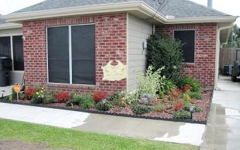Patterson Garden Club awarded Nedra Daigle one of its September Yard of the Month awards. Daigle’s landscaped yard features impatiens, a pink camellia bush, agapanthus and hibiscus. 