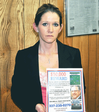 Denise Bailey, one of Glenn Lemoine’s daughters, holds a flyer in February asking for anyone with information about Lemoine’s death to contact their private investigator. The family is offering a $10,000 reward for the arrest and conviction of the person or people responsible for Lemoine’s death.