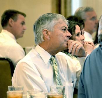 St. Mary Parish Levee District Executive Director Tim Matte listens while Jerome Zeringue, executive director of the Louisiana Coastal Protection and Restoration Authority, speaks during the St. Mary Industrial Group’s meeting Monday.