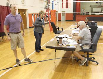 Voters approved a 20-year, $21 million bond issue to build a new Patterson Junior High School in Saturday's election. The vote will also add a multi-purpose building to Hattie Watts Elementary. From left are voter Doug Streety Jr. and commissioners Maureen Loudermilk, Richard Brinlee and Pearly Lightfoot. Also a commissioner, but not pictured, was Connie Escort.
