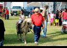 The third annual Hoodstock event was held Saturday on 11th Street at La. 182 in Morgan City. Among the features were rides, music and speakers. Jadyn Gibson, 3, of Morgan City, rides a pony named “Linda” accompanied by Jorge Gomez of AGA Farm Pony Rides in Covington. 
